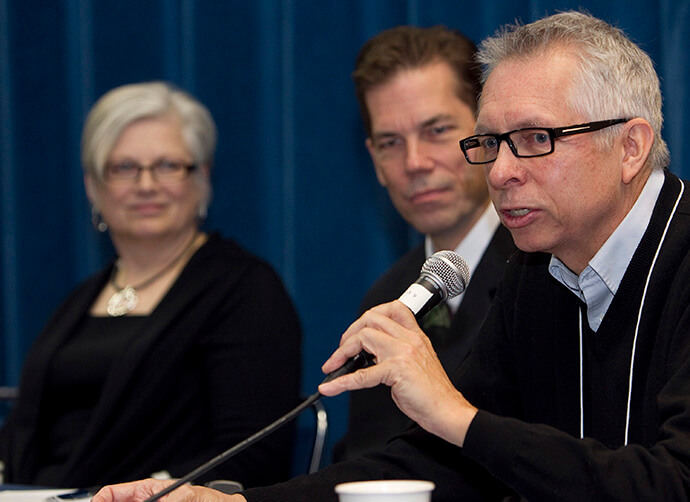 The Rev. Bruce W. Robbins (right) helps lead a discussion of "challenging issues" facing The United Methodist Church during the pre-General Conference news briefing at the Tampa Convention Center in Florida in 2012. Robbins was then pastor of Hennepin Avenue United Methodist Church in Minneapolis. At left are the Revs. Stephanie Hixon and Thomas Lambrecht. File photo by Mike DuBose, UM News.