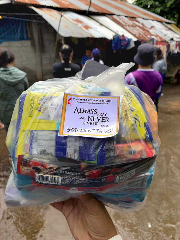 United Methodists brought donations with stickers that read, “Always Pray and Never Give Up,” to the victims of the devastating landslides in Maco, Davao de Oro. The donations were collected from a Paint For A Cause fundraiser. Photo courtesy of Dan Ela.