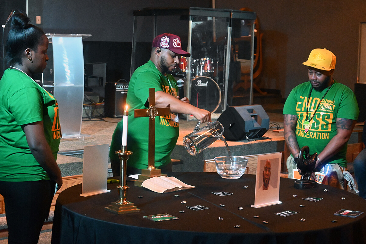An African Libation service is performed in honor of the late Marcellus Williams during the final day of the biennial National Summit on Mass Incarceration and Social Justice on Oct. 5 in Kansas City, Mo. Williams was put to death on Sept. 24 in the state, while questions about his murder conviction persisted. From left to right are the Rev. Samantha Nyachoto, pastor of Grace United Methodist Church in Dover, N.J.; the Rev. Kevin Kosh Jr., director and strategist of Strengthening the Black Church for the 21st Century’s National Network of Young Adults; and Nathaniel Callaway, founder of Ebony Excellence. Photo by Jim Patterson, UM News.