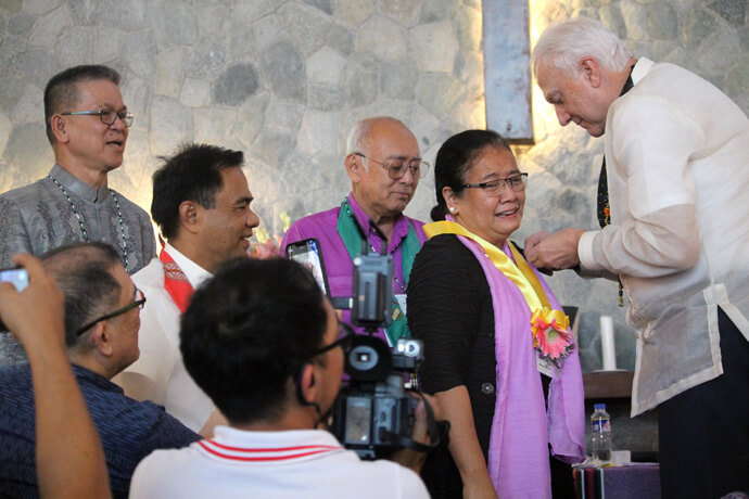 Newly elected Bishop Ruby-Nell Estrella, the first woman elected bishop in the Philippines, receives her episcopal pin from Bishop Thomas J. Bickerton (right) during the Philippines Central Conference in 2022. Central conferences in the Philippines, Africa and Europe plan to hold bishop elections in the coming months. Estrella and her fellow Filipino bishops face re-election when the Philippines Central Conference meets Nov. 18-22. Photo by Gladys P. Mangiduyos, UM News.