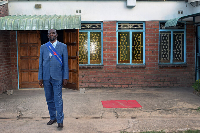 The Rev. Norest Munetsi Nyakudanga stands in front Seke South United Methodist Church in Chitungwiza, Zimbabwe. He died Oct. 22 while preaching at Chisipiti United Methodist Church in Harare. 2021 file photo by Eveline Chikwanah, UM News.