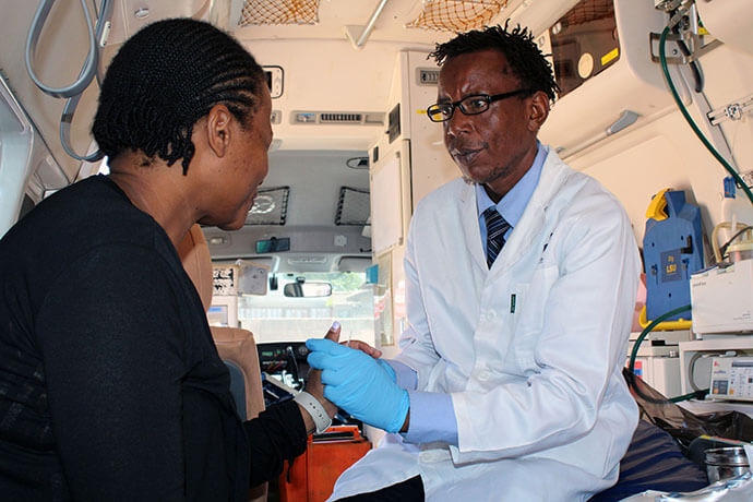 Takesure Chapamba (right) checks on a patient’s blood pressure during a health screening in Harare, Zimbabwe, in October. The United Methodist Church’s Sunningdale Circuit organized a health expo to provide free testing and resources to church members and the community. Photo by Kudzai Chingwe, UM News.