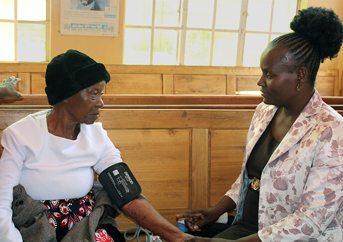 Basil Chonzi, a laboratory scientist at Sunningdale Medical Center, tests a patient for HIV during a free health expo in Harare, Zimbabwe. The center joined with The United Methodist Church’s Sunningdale Circuit to offer the free screenings. Photo by Kudzai Chingwe, UM News.