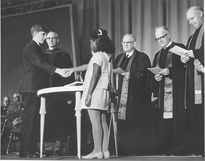 Robert O. Tupper II (left,) representing the Evangelical United Brethren, and Rhonda Renfro, representing the Methodist Church, were the two children chosen to shake hands as part of the ceremony uniting the two denominations into The United Methodist Church on April 23, 1968, in Dallas. Ashley Boggan, top executive of the United Methodist Commission on Archives and History, said the agency’s archives can be “a fantastic resource as a teaching tool.” File photo courtesy of the United Methodist Commission on Archives and History.