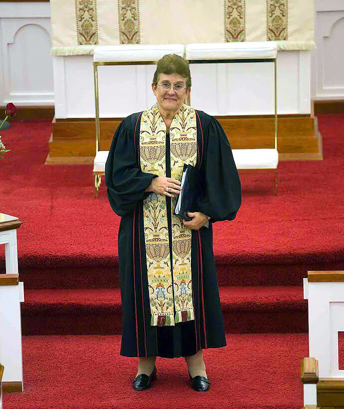 The Rev. Carrie Whitehurst Parrish officiates during her daughter Margaret’s wedding on Nov. 14, 2009, at what was then Cokesbury United Methodist Church in Stedman, N.C. Photo by Jimmy Allen.