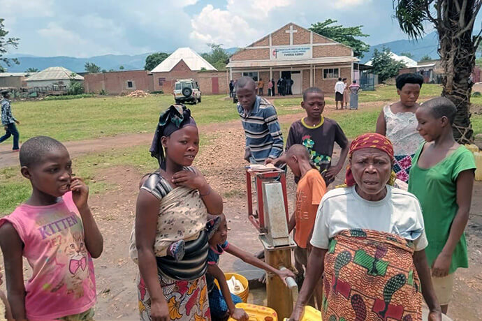 Christine Ntamubano expresses gratitude to The United Methodist Church in Burundi for providing clean drinking water closer to her home. Around 5,000 people in the region now have access to drinking water, thanks to a borehole installed by the church. Photo by Jérôme Ndayisenga, UM News.