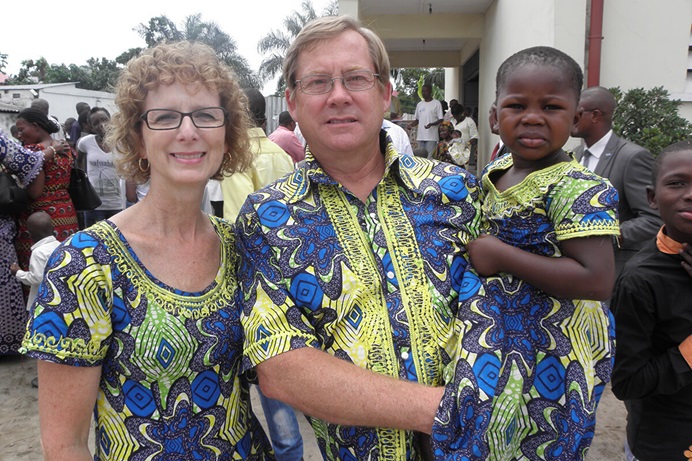 Susie and Ed Keefer pose with Miriam, age 4, in Kinshasa, Congo, in 2013. Shortly afterward, Miriam went home with the Keefers to the United States. The matching outfits were a gift from Dr. Rebecca Yohadi. Photo courtesy of Susie Keefer. Susie and Ed Keefer pose with Miriam, age 4, in Kinshasa, Congo, in 2013. Shortly afterward, Miriam went home with the Keefers to the United States. The matching outfits were a gift from Dr. Rebecca Yohadi. Photo courtesy of Susie Keefer.