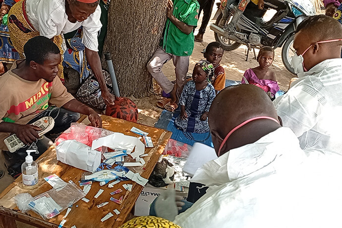 Dr. Naason Markus and other medical team members collect samples for diagnostic testing during a health expo sponsored by the United Methodist Women’s Fellowship at Yapilo Village in the Northern Nigeria Conference on March 29. The outreach included free medical check-ups and treatment for various health conditions, including hepatitis, high blood pressure, tuberculosis, vision problems, typhoid and malaria. Photo by Ibrahim Babangida, UM News.