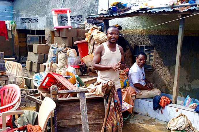 John Kodjo (standing), a member of Mapamboli United Methodist Church in Kinshasa, Congo, tries to salvage things from his flooded home. Torrential rains and flooding on April 5 damaged over 1,000 homes in the area and killed at least 33 people. Kodjo’s family fled on the roof of their home. Photo by the Rev. Fiston Okito, UM News. John Kodjo (standing), a member of Mapamboli United Methodist Church in Kinshasa, Congo, tries to salvage things from his flooded home. Torrential rains and flooding on April 5 damaged over 1,000 homes in the area and killed at least 33 people. Kodjo’s family fled on the roof of their home. Photo by the Rev. Fiston Okito, UM News.