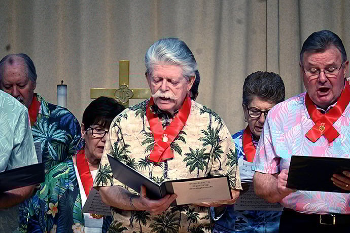 Greg Grim (center), a member of the Parkinson’s Education and Support Group of Sussex County Choir, performs with the group April 10 at Epworth United Methodist Church in Rehoboth Beach, Del. Photo by Jim Patterson, UM News.