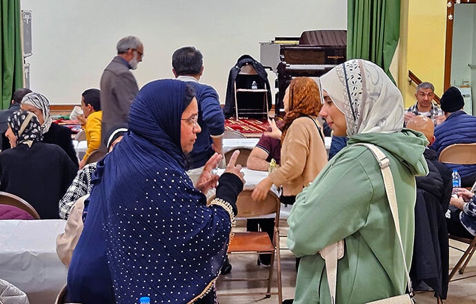 Members and guests of As-Salaam Islamic Society enjoy fellowship at their Iftar feast during Ramadan at St. Luke United Methodist Church in Bryn Mawr, Pa. Photo by John W. Coleman, UM News.