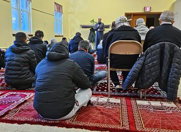 Members and guests of As-Salaam Islamic Society listen to a teaching (khutbah) by a guest lecturer during Friday afternoon prayers (Jum’ah) in St. Luke United Methodist Church’s Lurwick Hall. Photo by John W. Coleman, UM News.