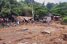 On a muddy street in the Ngaliema district of Kinshasa, residents attempt to salvage some belongings after floods destroyed homes and businesses in their neighborhood following torrential rains on June 14. Four United Methodists were among the nearly 30 people who lost their lives in the floods. Photo by the Rev. Fiston Okito, UM News. On a muddy street in the Ngaliema district of Kinshasa, residents attempt to salvage some belongings after floods destroyed homes and businesses in their neighborhood following torrential rains on June 14. Four United Methodists were among the nearly 30 people who lost their lives in the floods. Photo by the Rev. Fiston Okito, UM News.