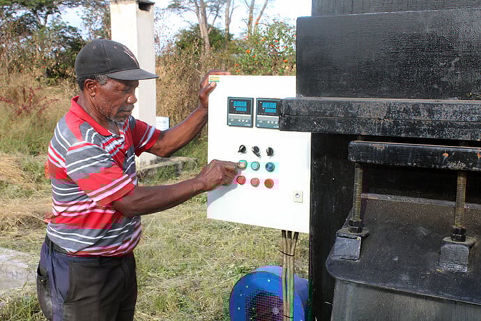 Gerbet Musororerwa, the general hands supervisor for the Nyadire Mission Hospital in Zimbabwe, points out the benefits of having a new incinerator that requires only the pressing of a button over using firewood. Upgrades to the Old Mutare and Nyadire mission hospitals have meant better care for those in rural communities. Photo by Kudzai Chingwe, UM News.