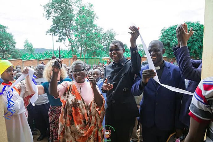 Dr. Lyduine Baradahana (left), Burundi Minister of Public Health and AIDS Control, cuts the ribbon at the inauguration ceremony for the Gahambwe Health Center in Burundi’s Ruyigi province, alongside United Methodist Bishop Emmanuel Sinzohagera (center) and the Rev. Japhet Nderibicuro, superintendent of the Kinyinya District. The event marks the culmination of a partnership between The United Methodist Church of Burundi and the United Methodist Board of Global Ministries to improve access to health care in the region. Photo by Jérôme Ndayisenga, UM News.