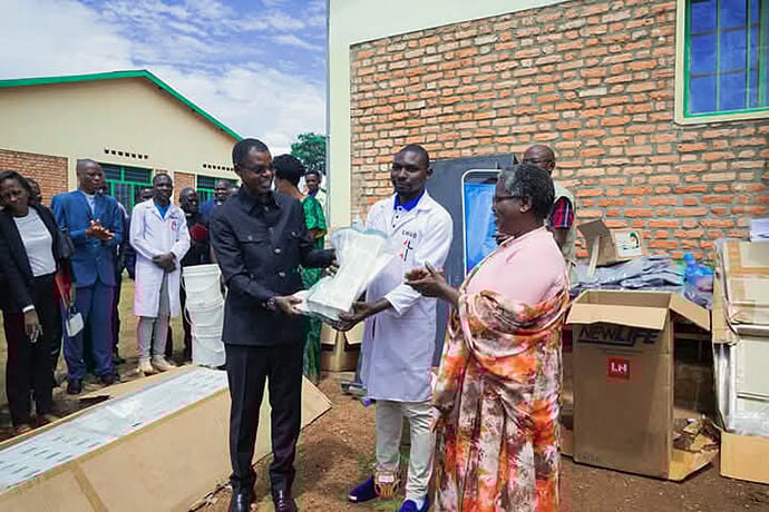 In the center, Niyoyankunze Philemon, head of the health center, and Bishop Emmanuel Sinzohagera (left) receive medical equipment from Dr. Lyduine Baradahana (left), Burundi health minister. This donation is part of a shared commitment to improving the quality of care provided in Gahambwe. Photo by Jérôme Ndayisenga, UM News.