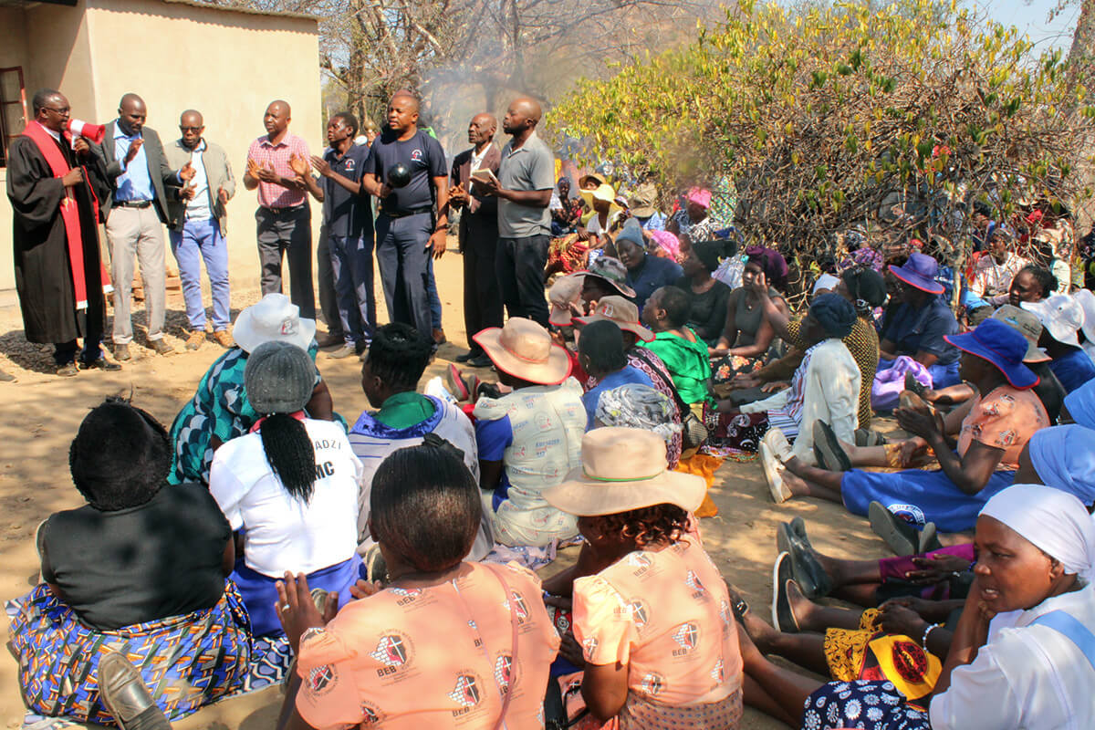 Members of The United Methodist Church’s Morning Service in rural Zimbabwe join family and friends at a funeral for a fellow church member. The early service in Nyanyadzi began with three people and has grown to more than 40 since its start three years ago. Photo by Kudzai Chingwe, UM News.
