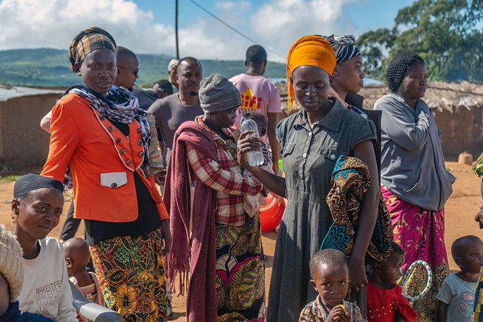 Beneficiaries of a United Methodist-sponsored nutrition program gather at Dzaleka Refugee Camp in Dowa District, Malawi. The camp is home to an estimated 57,000 refugees. The church initiative provides a monthly clinic that offers supplementary feeding programs for those at the camp most at risk of malnutrition. Photo by Francis Nkhoma, UM News. Beneficiaries of a United Methodist-sponsored nutrition program gather at Dzaleka Refugee Camp in Dowa District, Malawi. The camp is home to an estimated 57,000 refugees. The church initiative provides a monthly clinic that offers supplementary feeding programs for those at the camp most at risk of malnutrition. Photo by Francis Nkhoma, UM News.