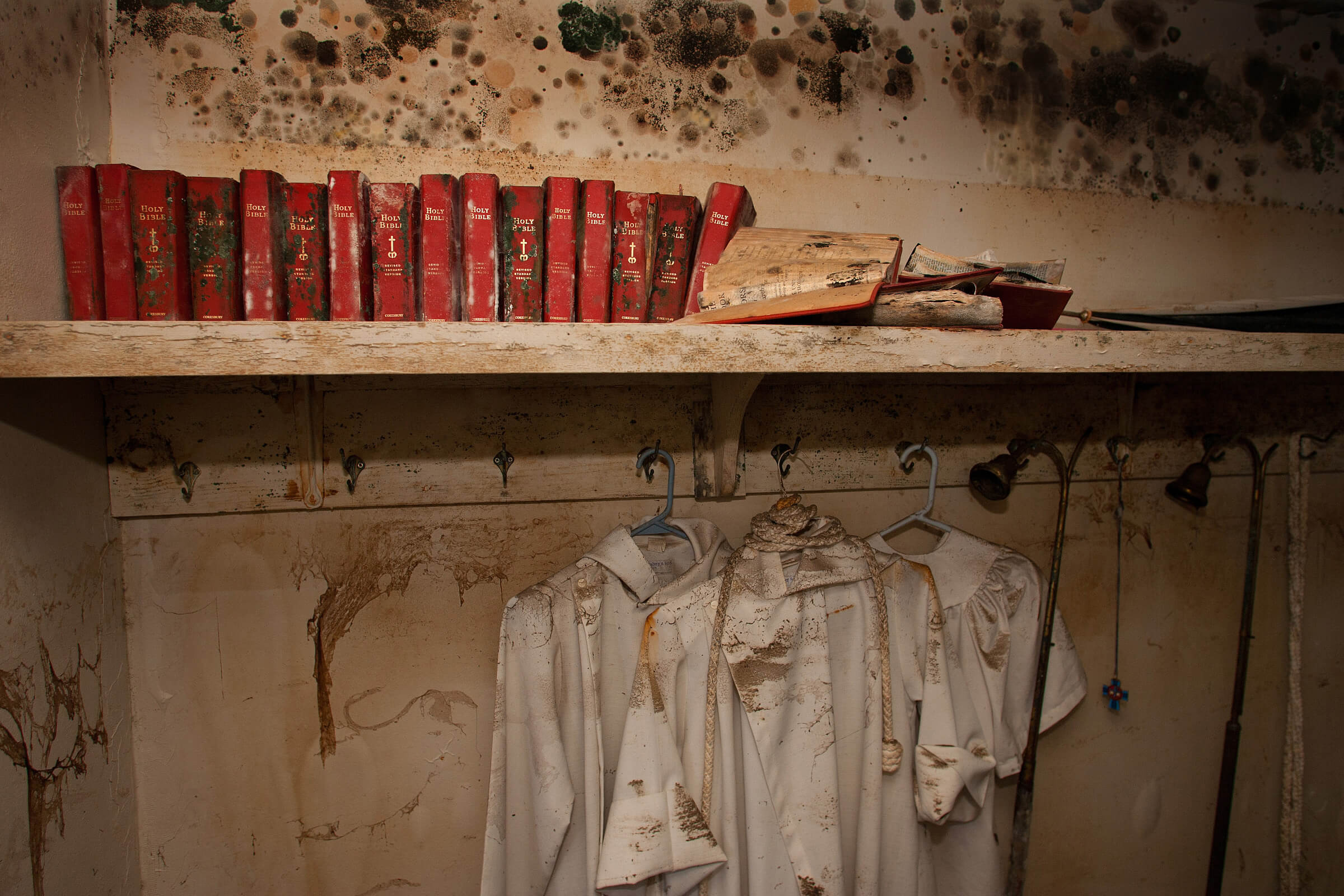 Mold covers the walls, Bibles and acolyte robes in the sacristy at St. Luke’s United Methodist Church following Hurricane Katrina. Photo by Mike DuBose, UM News. Mold covers the walls, Bibles and acolyte robes in the sacristy at St. Luke’s United Methodist Church following Hurricane Katrina. Photo by Mike DuBose, UM News.
