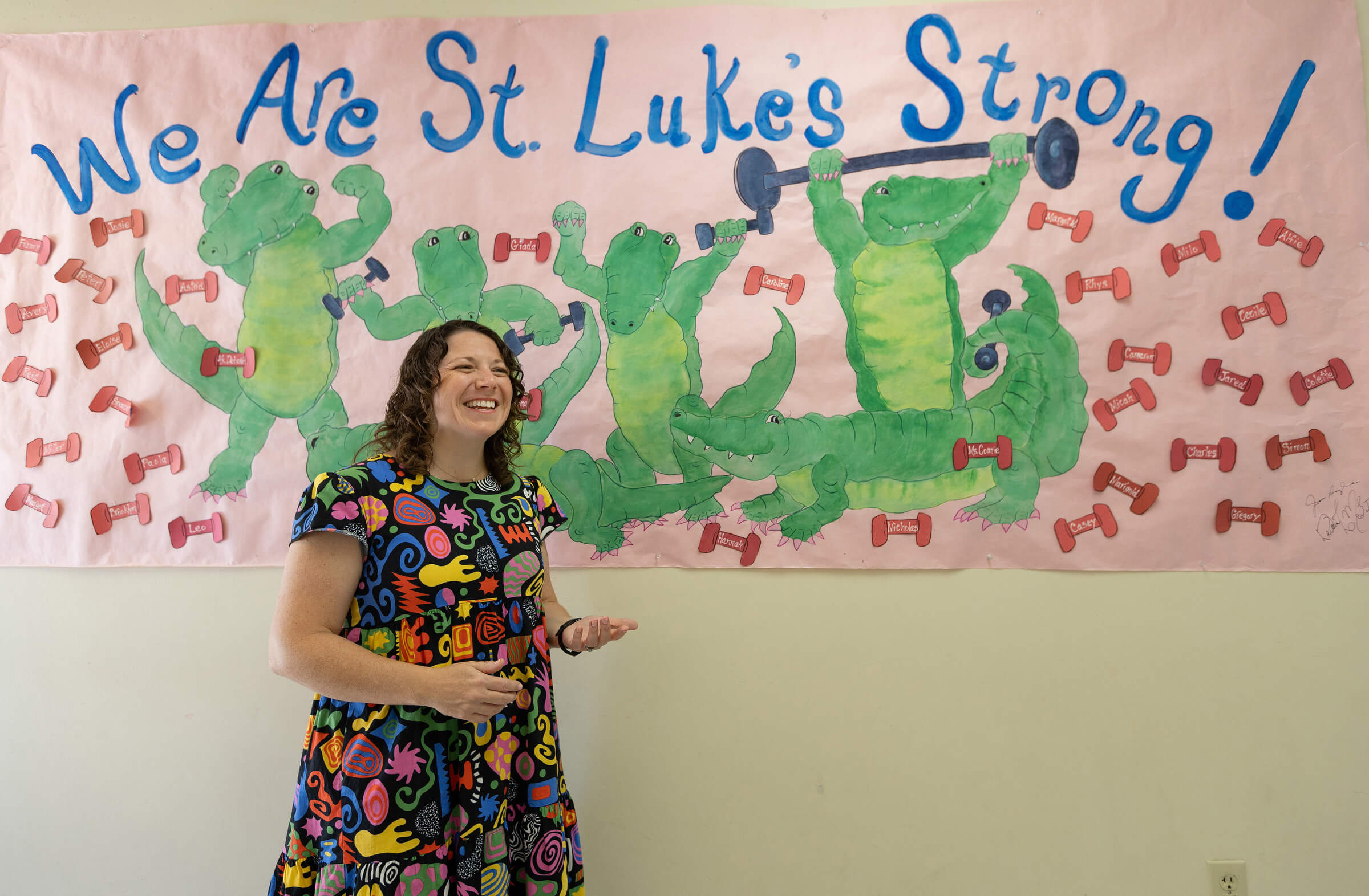 The Rev. Colleen Bookter talks about how St. Luke’s United Methodist Church in New Orleans was changed by Hurricane Katrina. She is standing in front of a poster honoring the church’s current class of nursery school students. The school was one of the first ministries of the church to reopen after Katrina. Photo by Mike DuBose, UM News. The Rev. Colleen Bookter talks about how St. Luke’s United Methodist Church in New Orleans was changed by Hurricane Katrina. She is standing in front of a poster honoring the church’s current class of nursery school students. The school was one of the first ministries of the church to reopen after Katrina. Photo by Mike DuBose, UM News.