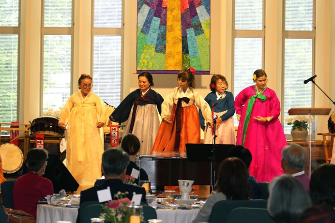 The Ohio Korean-American Pungmulnori Team dances during the opening dinner for Celebrating Methodist Missions in Ohio, Korea and Beyond on Aug. 4 at Church of the Saviour United Methodist Church in Cleveland Heights, Ohio. Photo by the Rev. Thomas E. Kim, UM News.   The Ohio Korean-American Pungmulnori Team dances during the opening dinner for Celebrating Methodist Missions in Ohio, Korea and Beyond on Aug. 4 at Church of the Saviour United Methodist Church in Cleveland Heights, Ohio. Photo by the Rev. Thomas E. Kim, UM News.