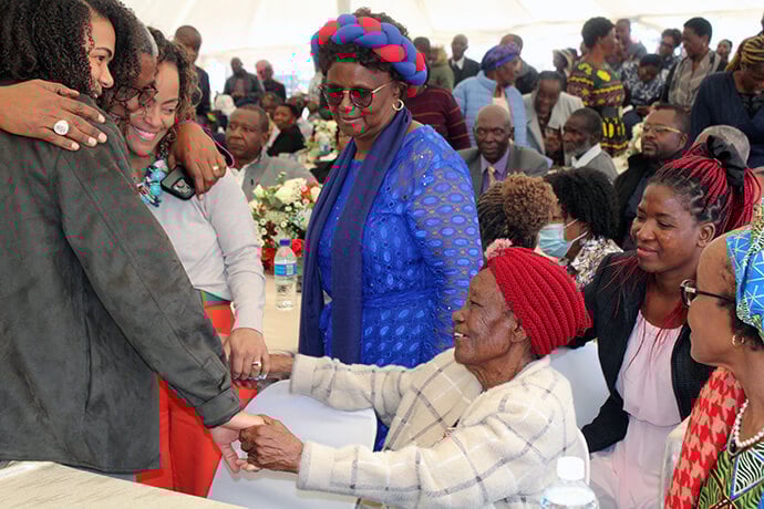 From left, Tanyaradzwa Kajese, Bishop Malusi Mpumlwana, Tinashe Kajese, Caroline June Kajese, Janet Gowe and Thoko Mpumlwana catch up following the dedication of Hoyuyu United Methodist Church’s Nzira Sanctuary in May. Photo by Kudzai Chingwe, UM News.
