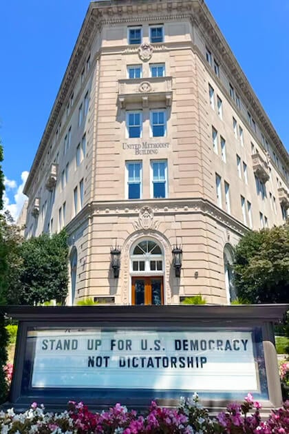 The sign in front of the United Methodist Building currently proclaims, “Stand Up for U.S. Democracy, Not Dictatorship.” The building, across from the U.S. Supreme Court, is overseen by the United Methodist Board of Church and Society and also houses the United Methodist Commission on Religion and Race, among other nonprofits. Photo by Jeffrey Corey, Church and Society.