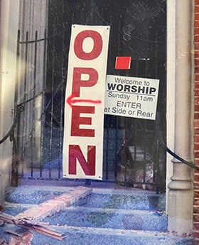 A temporary sign directs visitors to a safe entrance at Rayne United Methodist Church following Hurricane Katrina. Photo courtesy of the Rev. Callie Winn Crawford.