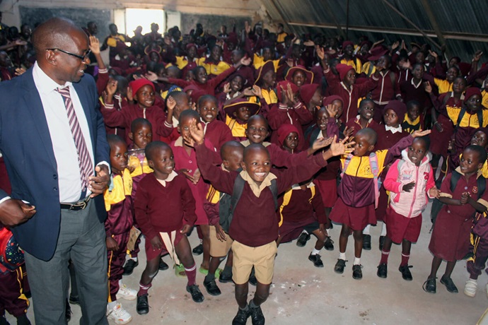 Students dance with joy after a worship service at Dindi Mission’s primary school in Mutawatawa, Zimbabwe. At left is Fungai Chimuti, the school’s headmaster. A new boarding facility for the mission’s schools is helping address high dropout rates and other challenges. Photo by Kudzai Chingwe, UM News. Students dance with joy after a worship service at Dindi Mission’s primary school in Mutawatawa, Zimbabwe. At left is Fungai Chimuti, the school’s headmaster. A new boarding facility for the mission’s schools is helping address high dropout rates and other challenges. Photo by Kudzai Chingwe, UM News.