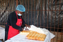 Rumbidzai Munetsi of Divine Grace Bakery separates freshly baked buns into batches for sale at Hunyani United Methodist Church in Chitungwiza, Zimbabwe. Munetsi is a member of the church, where group members meet to bake on Tuesdays and Thursdays. Photo by Eveline Chikwanah, UM News. Rumbidzai Munetsi of Divine Grace Bakery separates freshly baked buns into batches for sale at Hunyani United Methodist Church in Chitungwiza, Zimbabwe. Munetsi is a member of the church, where group members meet to bake on Tuesdays and Thursdays. Photo by Eveline Chikwanah, UM News.