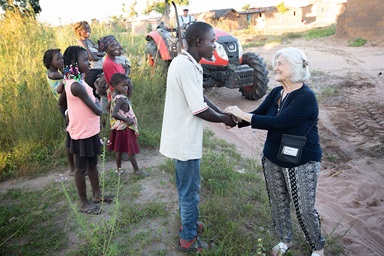Sandi Goodman (right) visits with residents of Mufongo village, part of the United Methodist Quéssua Mission in Angola. Goodman was part of a Volunteers in Mission team from the Florida Conference. Volunteers in Mission leaders met Sept. 2-3 outside Chicago to discuss how their disciple-making ministry can last for years to come. File photo by Mike DuBose, UM News. Sandi Goodman (right) visits with residents of Mufongo village, part of the United Methodist Quéssua Mission in Angola. Goodman was part of a Volunteers in Mission team from the Florida Conference. Volunteers in Mission leaders met Sept. 2-3 outside Chicago to discuss how their disciple-making ministry can last for years to come. File photo by Mike DuBose, UM News.