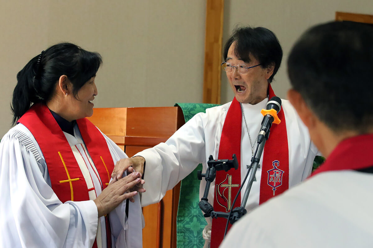 Bishop Jeremiah J. Park (right) congratulates the Rev. R. Jargaltsetseg during the ordination service at the United Methodist Mongolia Mission Initiative’s annual meeting, held at Gerelt United Methodist Church in Ulaanbaatar, Mongolia, on Aug. 30. Jargaltsetseg was ordained as a mission elder. Photo by the Rev. Thomas E. Kim, UM News.