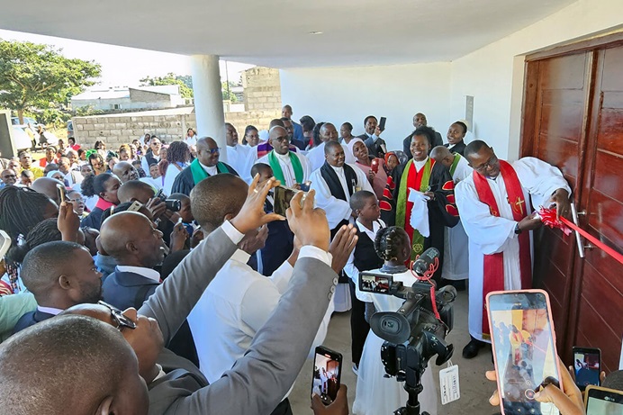 Bishop João Filimone Sambo cuts the ribbon at the July dedication of Muhalaze United Methodist Church’s new permanent chapel on the outskirts of Maputo, Mozambique. The church’s Muhalaze Mission Field has grown into six local churches with more than 300 members, but this is its first permanent structure. Photo by Roque Facela, UM News. Bishop João Filimone Sambo cuts the ribbon at the July dedication of Muhalaze United Methodist Church’s new permanent chapel on the outskirts of Maputo, Mozambique. The church’s Muhalaze Mission Field has grown into six local churches with more than 300 members, but this is its first permanent structure. Photo by Roque Facela, UM News.