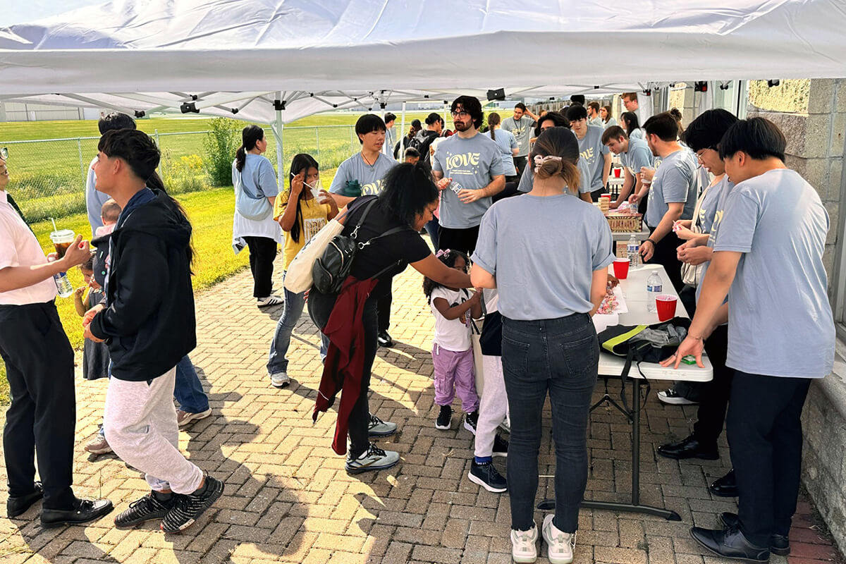 Families visit booths set up outside Chicago First Korean United Methodist Church in Wheeling, Ill., during the church’s Sept. 13 “Great Feast for Refugees and Neighbors.” The event marked the congregation’s 102nd anniversary and its commitment to supporting vulnerable members of the community. Families from refugee centers across Chicago participated in a day filled with worship, music, food, fellowship and practical support. Photo courtesy of Chicago First Korean United Methodist Church.