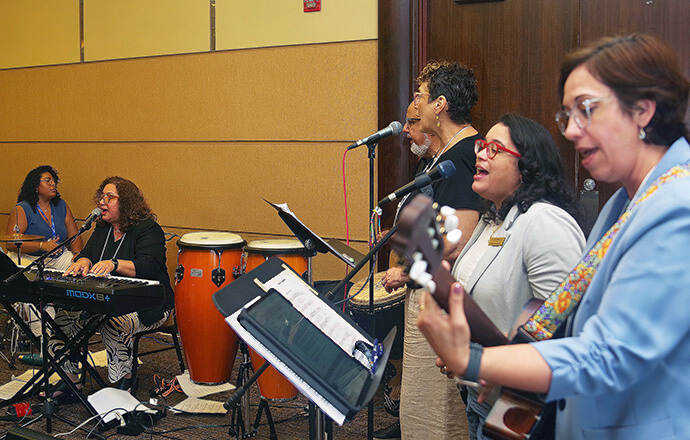 Musicians perform during worship service at the 53rd MARCHA Assembly. From left to right are Yolanda Santiago, the Rev. Lydia Muñoz, Tercio Júnker, Miriam Richardson, Dorlimar Lebron and Fabiola Grandon-Mayer. Photo by the Rev. Gustavo Vasquez, UM News.