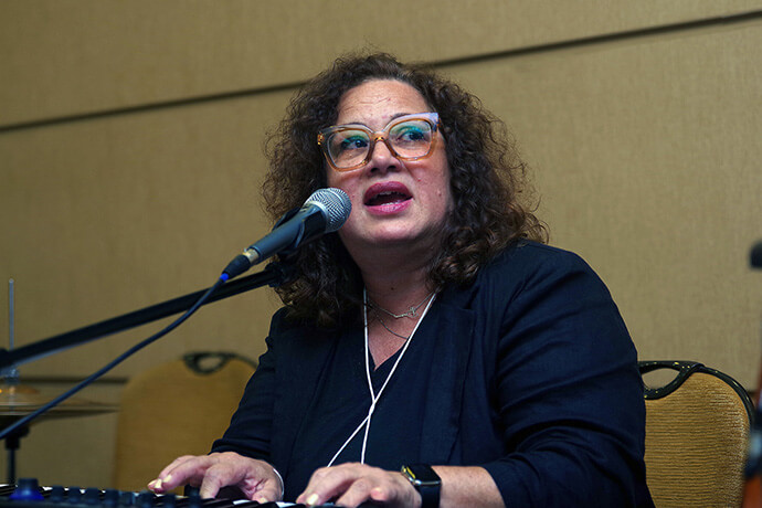 The Rev. Lydia Muñoz, director of El Plan for Hispanic-Latine Ministry of The United Methodist Church, leads worship service during the 53rd MARCHA Assembly in Chicago. Photo by the Rev. Gustavo Vasquez, UM News.