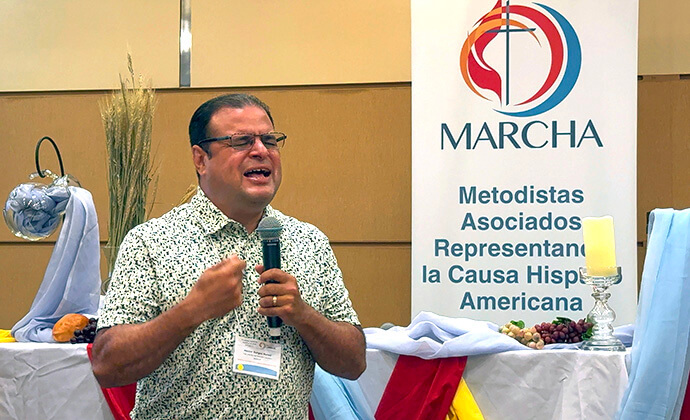 Bishop Héctor A. Burgos-Núñez, episcopal leader of the Upper New York and Susquehanna conferences, leads the closing prayer at the 53rd annual MARCHA Assembly Aug. 3 in Chicago. Photo by the Rev. Gustavo Vasquez, UM News.