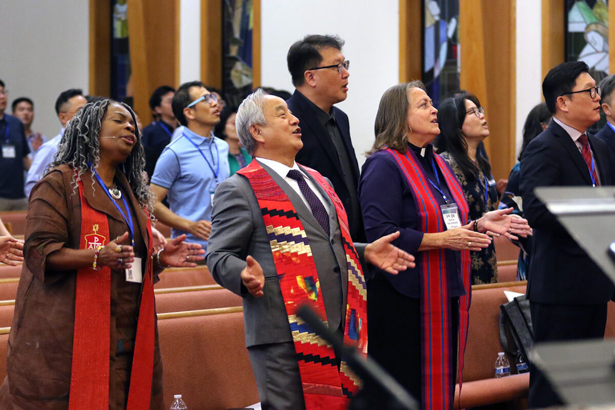 Participants sing praises during the opening worship of the Korean Association of The United Methodist Church, held Sept. 29 at Calvary Korean United Methodist Church in East Brunswick, New Jersey. Pictured (from left): Bishops Cynthia Moore-Koikoi of the Greater New Jersey and Eastern Pennsylvania conferences; Hee-Soo Jung of the Ohio Episcopal Area; Dottie Escobedo-Frank of the California-Pacific Conference; and the Rev. Kyu Hyun Kim, pastor of Berkeley Korean United Methodist Church in Orinda, Calif. Photo by the Rev. Thomas E. Kim, UM News.