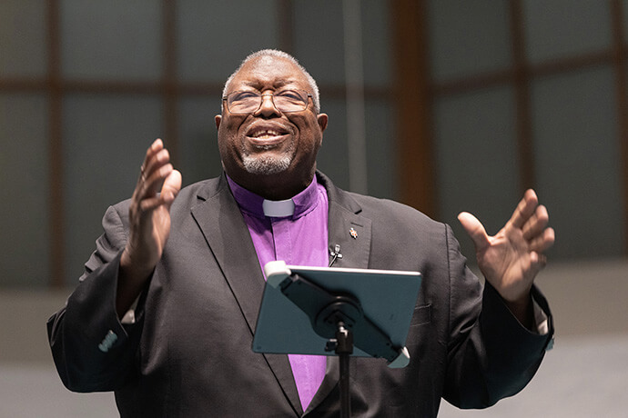 Bishop Frank Beard tells parishioners he believes that “Jesus can catch fish anywhere,” during his sermon at Elkhart Faith United Methodist Church. He says he plans to use his love of fishing to help churchgoers net new Christians. Photo by Mike DuBose, UM News.