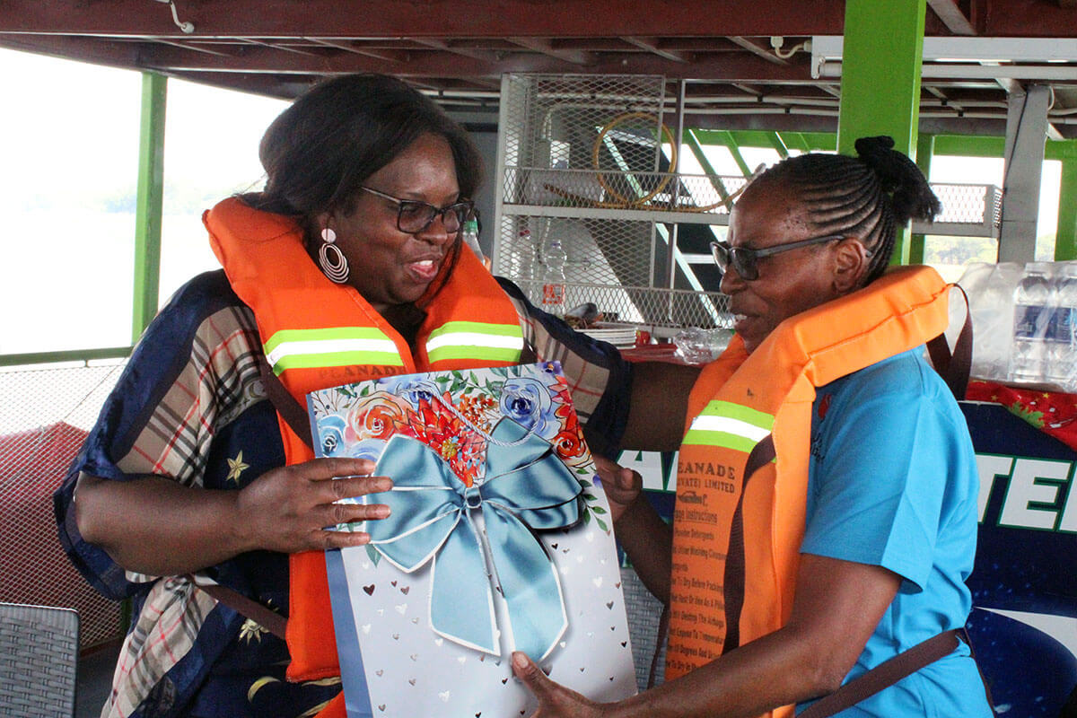 Zivorashe Mujaji and Charlotte Kubara exchange a gift during their assignment as prayer partners during a Women of Substance retreat at Lake Chivero in Harare, Zimbabwe. The organization, which partners with the Indiana Conference, invites participants from neighboring districts to build connection and unity across regions. Photo by Kudzai Chingwe, UM News.  