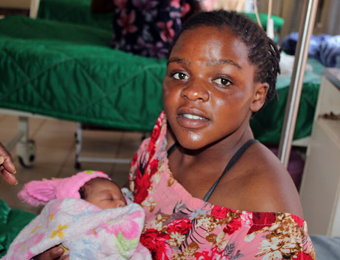 Loice Mauna, from Chikanga in Mutare District, holds her second baby at Old Mutare Mission Hospital in Zimbabwe. Through partnerships between United Methodists in Zimbabwe, Norway and the U.S., the church’s Old Mutare and Mutambara mission hospitals are providing improved care for expectant mothers. Photo by Kudzai Chingwe, UM News.