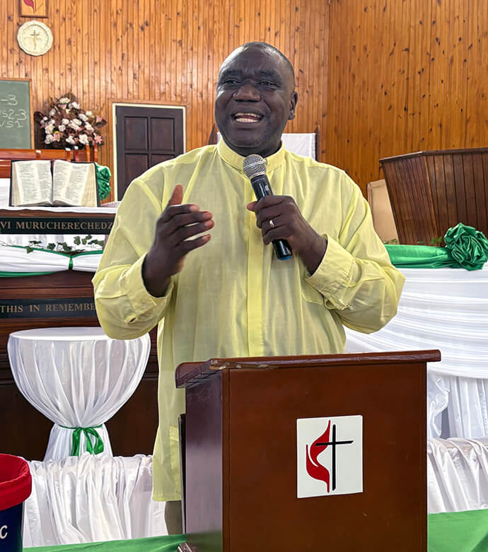 The Rev. Togara Bobo, pastor in charge at St. Peter’s Inner City United Methodist, preaches during a lunch-hour service in the church sanctuary on July 24. Bobo started the popular services 15 years ago to offer hope and inspiration to struggling communities. The prayer services now draw hundreds on Tuesday and Thursday afternoons. Photo by Eveline Chikwanah, UM News. 