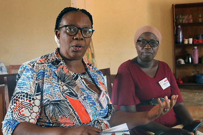 Godelieve Manirakiza (left) explains how the training center at Nyabugogo United Methodist Church operates. The center offers tailoring training to members of the neighboring community, equipping them to establish their own businesses after completing classes. Photo by Eveline Chikwanah, UM News.