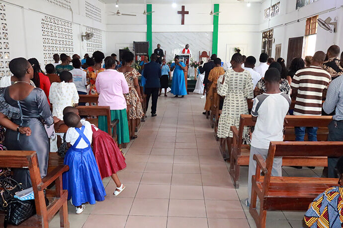 Worshippers attend a United Methodist service in Dar es Salaam, Tanzania. The country’s United Methodist Church is encouraging parishioners to pray for peace and reconciliation to heal social divisions caused by post-election violence. Photo by Asaph Sungura Ally, UM News.