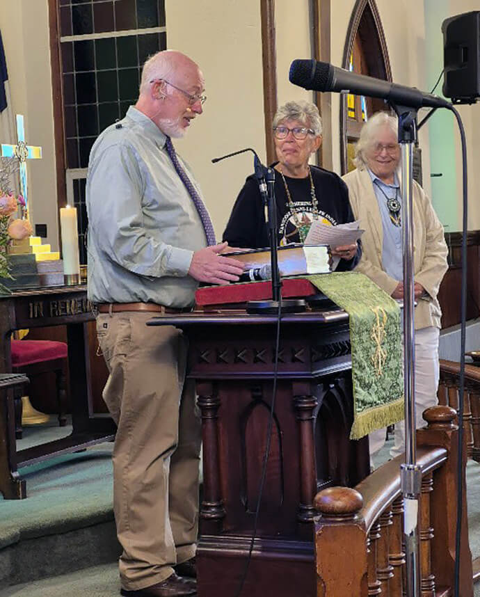 The Rev. David Eckert (left), pastor of Marshallton United Methodist Church, thanks Cynthia Mosley and Barbara Revere of the Greater New Jersey and Eastern Pennsylvania committees on Native American Ministry, respectively, for helping Marshallton develop a land acknowledgement statement that Eckert read to the congregation during its Native American Sunday celebration on Oct. 12.  Photo by Sandy Haftl.