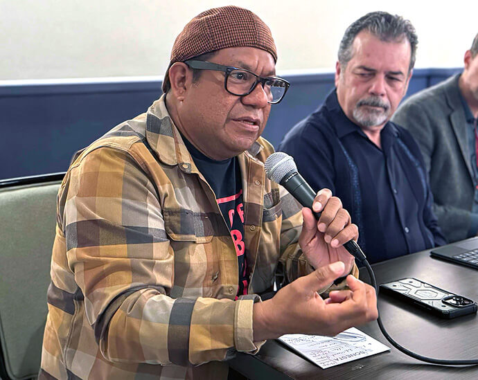 Pablo Alvarado (left), executive director of the National Day Laborer Organizing Network, and the Rev. Carlos Rincón, executive director and president of the Latino Community Development Corporation, Institute for Comprehensive Advancement, take part in discussions during the United Methodist Immigration Task Force meeting, held Nov. 18-20 in Los Angeles. Photo by the Rev. Gustavo Vásquez, UM News.