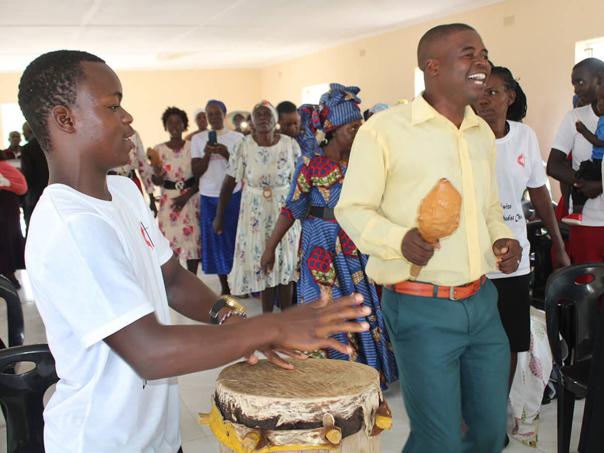 Preacher Simbarashe Soza (right) helps lead worship at Donzwe United Methodist Church, near Mudzi, Zimbabwe. Photo by Kudzai Chingwe, UM News.