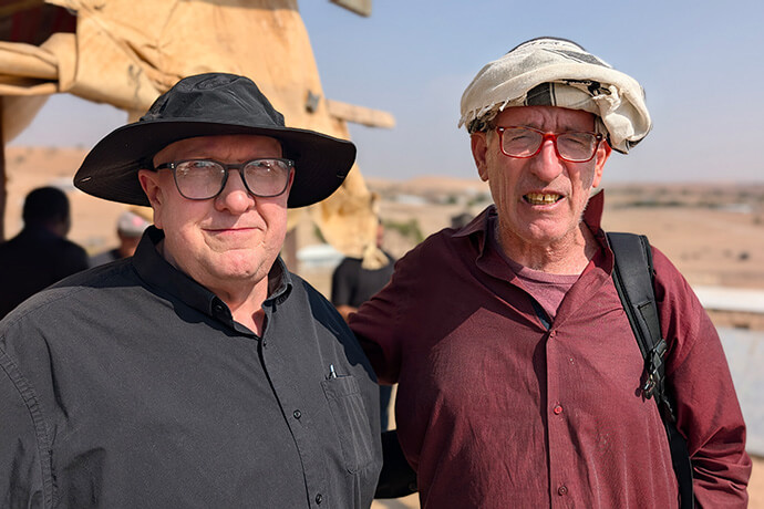 The Rev. John Wagner (left) stands with a Jewish Israeli man who is providing a protective presence at night for Palestinian villagers in the West Bank. Photo by Andrew Larson, Peace Catalyst International.