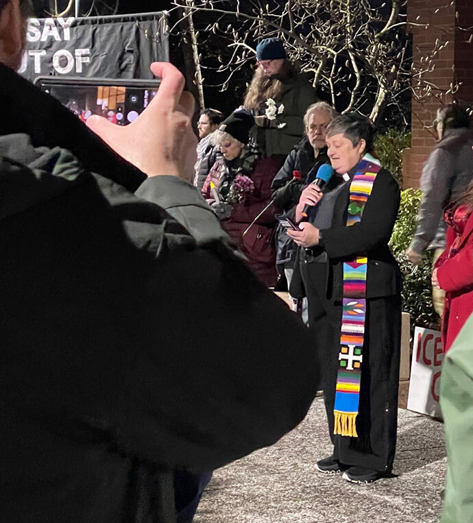 The Rev. Heather Riggs, pastor of Montavilla United Methodist Church in Portland, Ore., leads a prayer at a Jan. 9 vigil held near where a Customs and Border Patrol agent shot Luis David Nino-Moncada and Yorlenys Betzabeth Zambrano-Contreras the day before. Photo by the Rev. Drew Hogan.