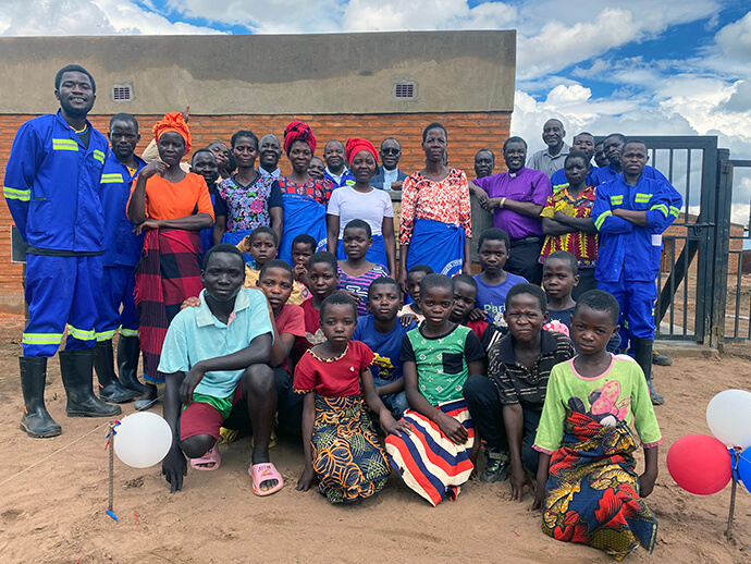 Bishop Gift K. Machinga stands with Mikundi Dairy Farm staff and members of the surrounding community after the farm’s dedication ceremony in November. The farm is seen as a highlight of the Malawi Provisional Annual Conference, which is rebounding after years of legal turmoil. Photo by Francis Nkhoma, UM News.